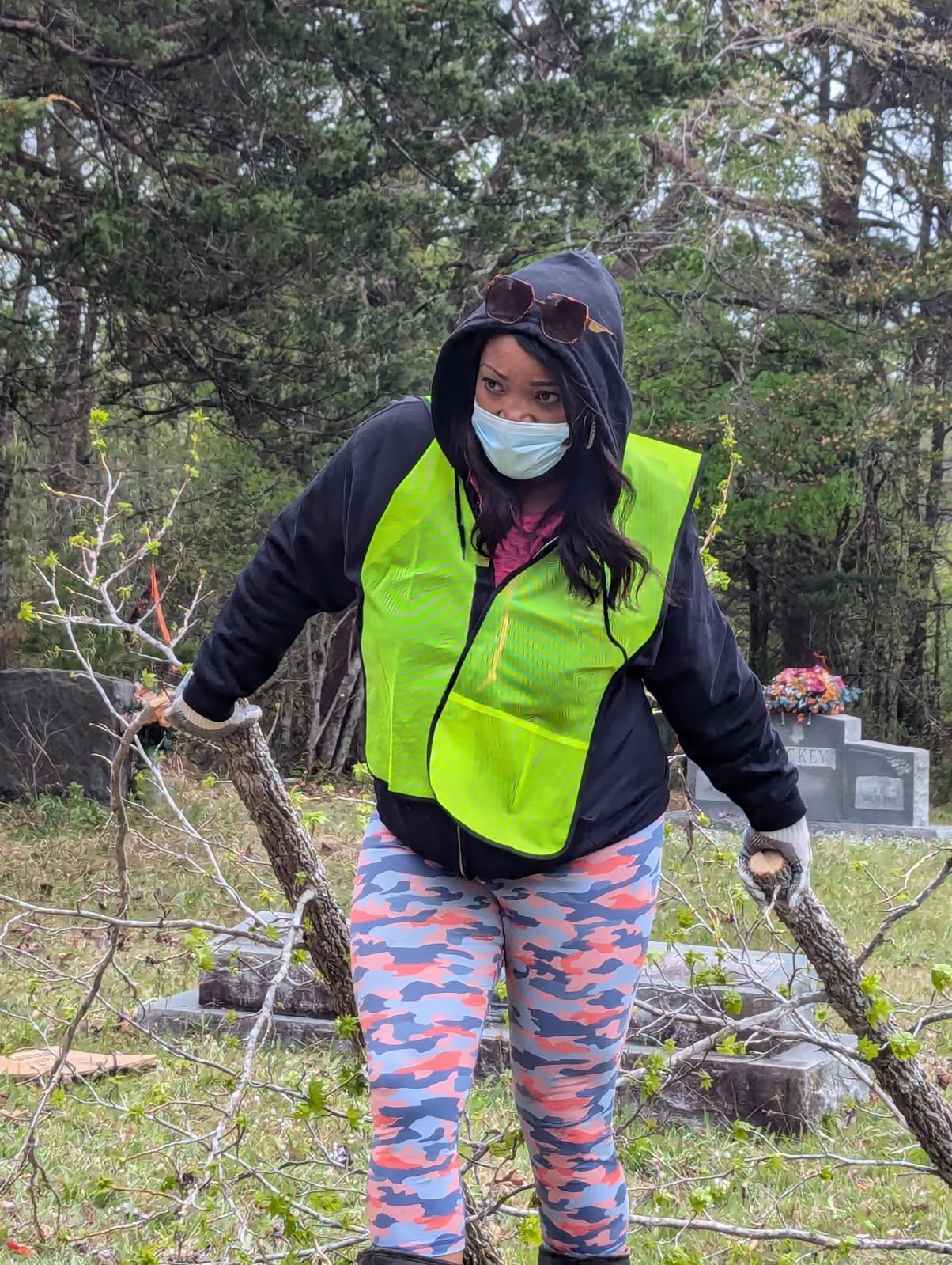 Community volunteers working near headstones