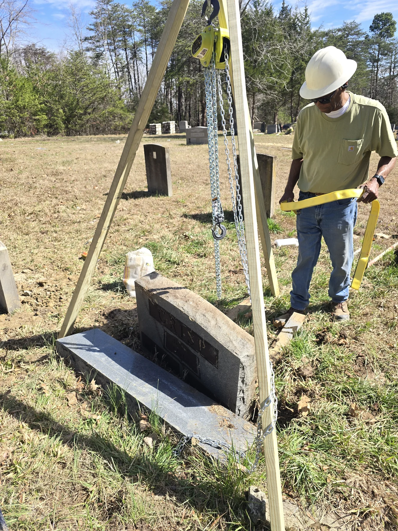 Tripod in action lifting a historic headstone during restoration work at Snow Hill Cemetery